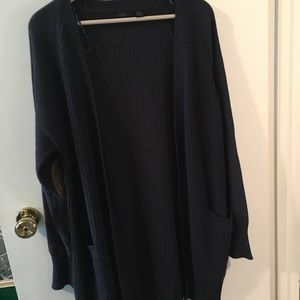 Navy blue knit sweater with brown elbow patches